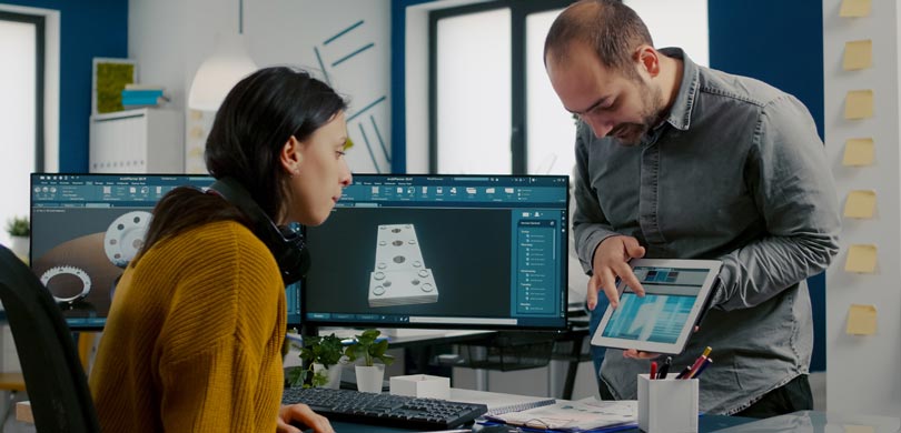 cad designer at office discuss with another designer