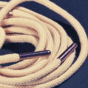 metal tipping with brown color cord